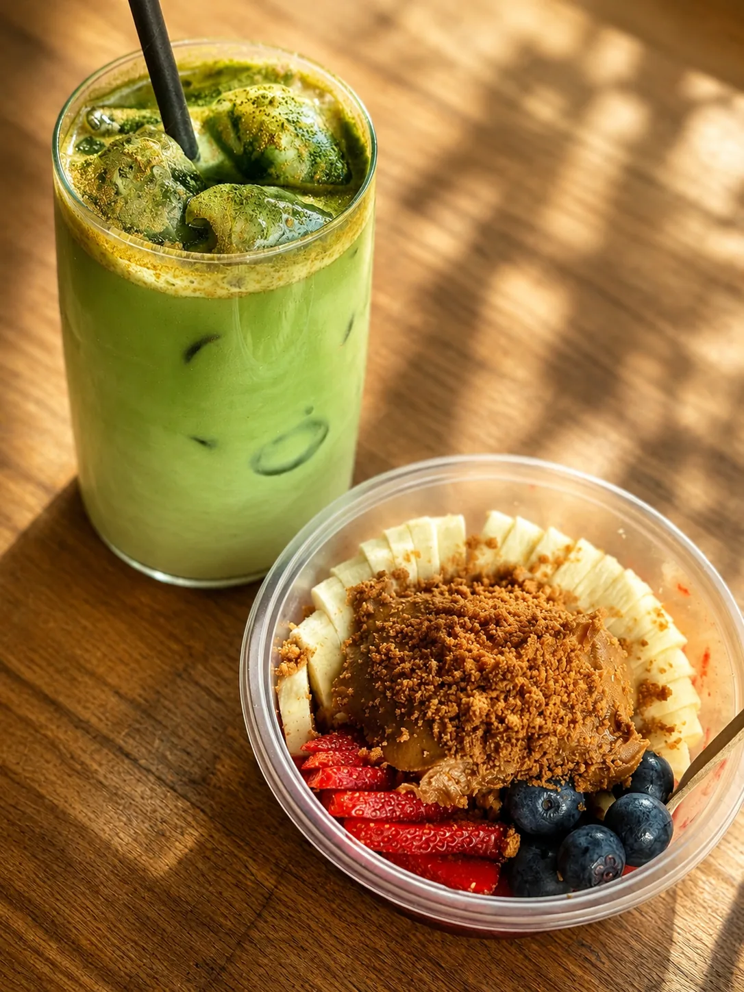 Matcha drink and fruit bowl at Blend Coffee Shop